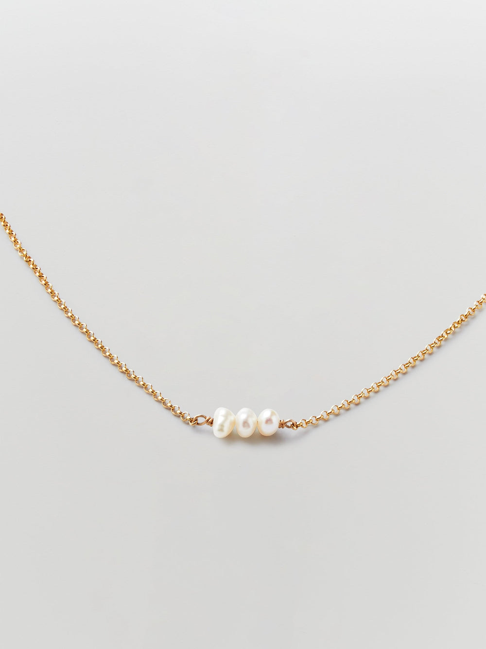 the line of sun triple pearl necklace